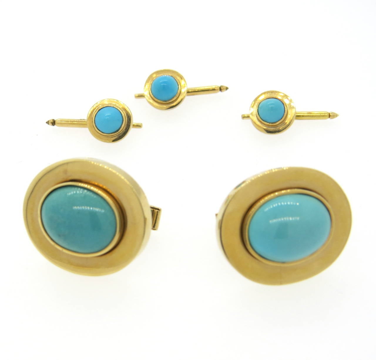 Set of massive 14k gold cufflinks and three shirt studs, set with turquoise stones. Cufflinks measure 25mm x 21mm, studs measure 10.5mm in diameter. Weight of the set - 43.7 grams