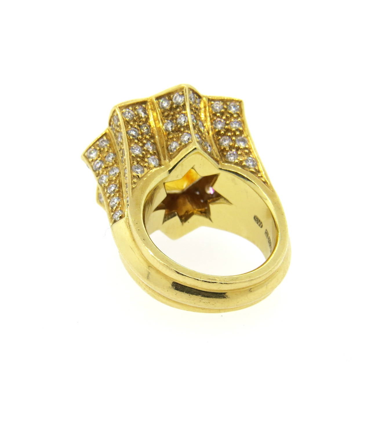 Large 18k yellow gold ring, crafted by Stephen Webster, featuring 16mm x 16mm citrine, surrounded with approximately 1.50ctw in diamonds. Ring is a size 5, ring top is 23mm x 23mm. Marked SW, 750 and with English marks. Weight of the piece - 22.1