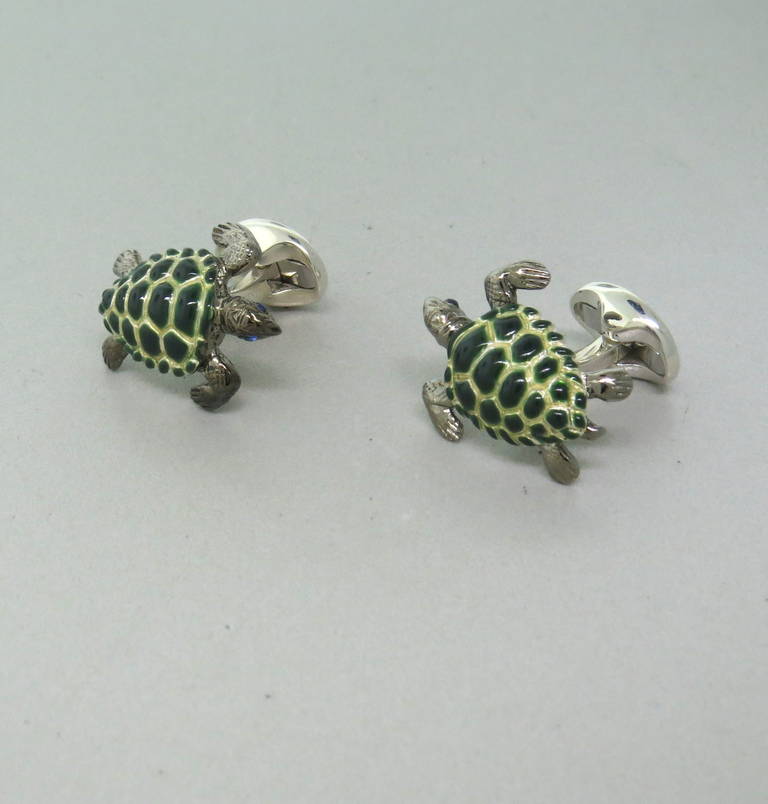 Brand new Deakin & Francis sterling silver enamel turtle cufflinks featuring sapphires as eyes. Come with original box and papers. Cufflinks measure 25mm x 20mm, weight -26.7g.