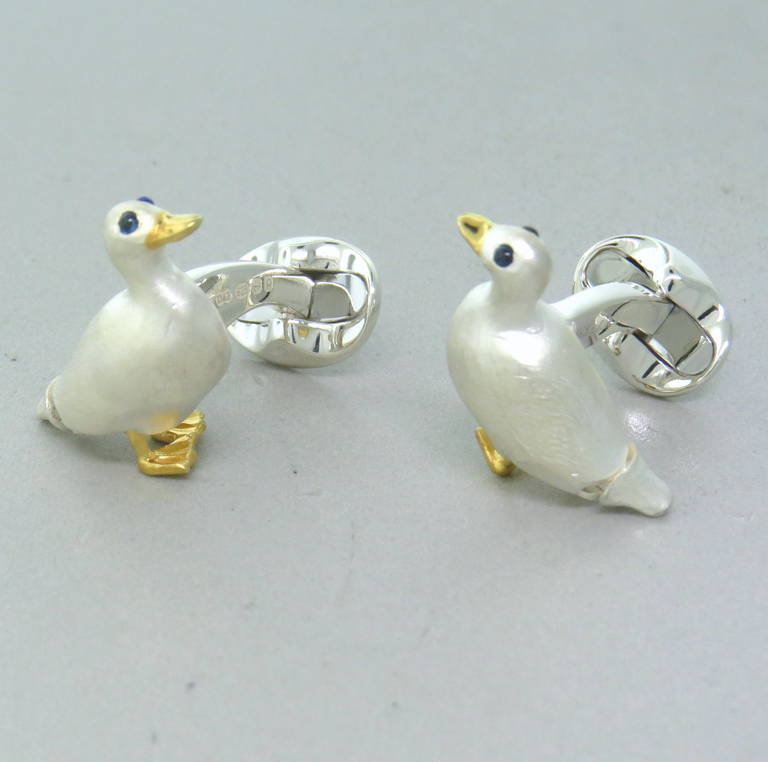 Brand new Deakin & Francis sterling silver duck cufflinks featuring sapphire eyes. Come with original box and papers. Cufflinks measure 28mm x 22mm, weight - 21.4gr