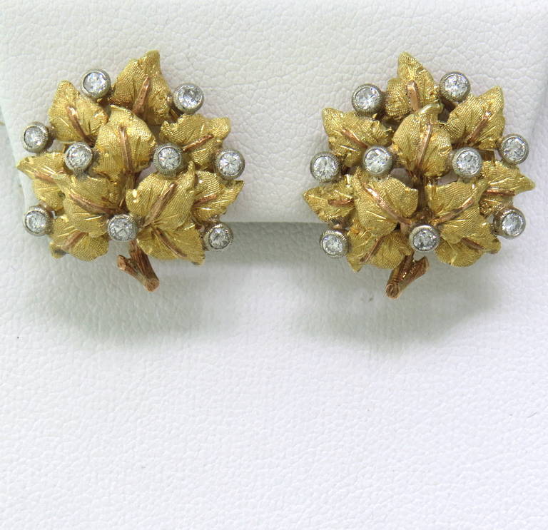 Intricate 18k Gold Leaf Earrings, crafted by Mario Buccellati. Set with approximately 0.50ctw  VS-SI1 / H Diamonds.  The earrings measure 21mm x 10.5mm and weigh 11.8 grams.