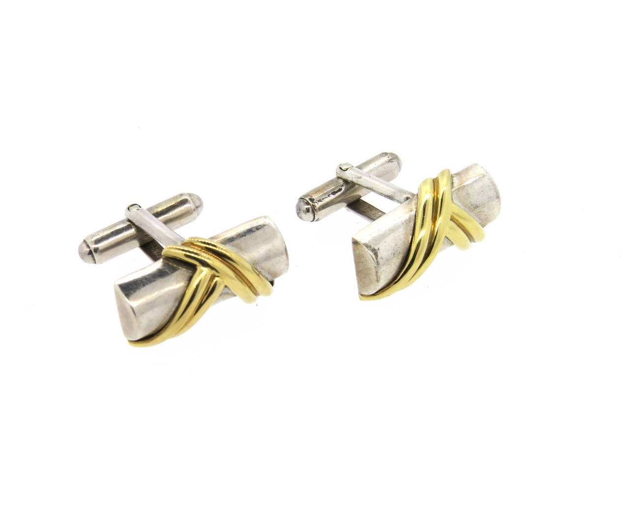 Pair of sterling silver and 18k gold cufflinks, crafted by Tiffany & Co. Cufflink top measures 22mm x 13mm. Marked 925,750 and Tiffany & Co. Weight - 15.5 grams