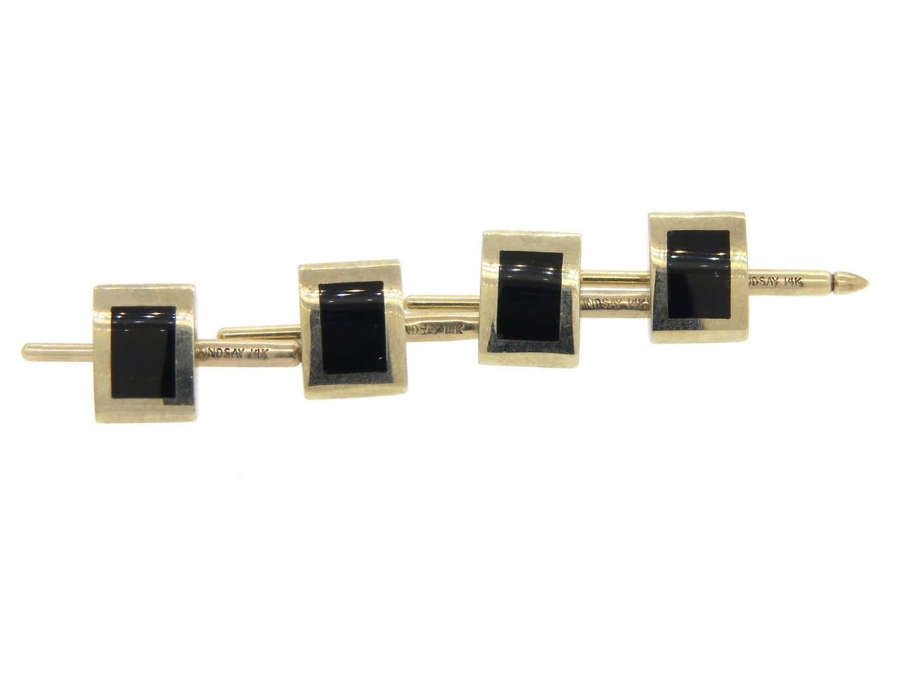 Set of four 14k gold dress studs, crafted by Lindsay & Co, set with black onyx inlay. Each stud top measures 11mm x 8.2mm. Marked 14k and Lindsay. Weight of the set - 13.5 grams