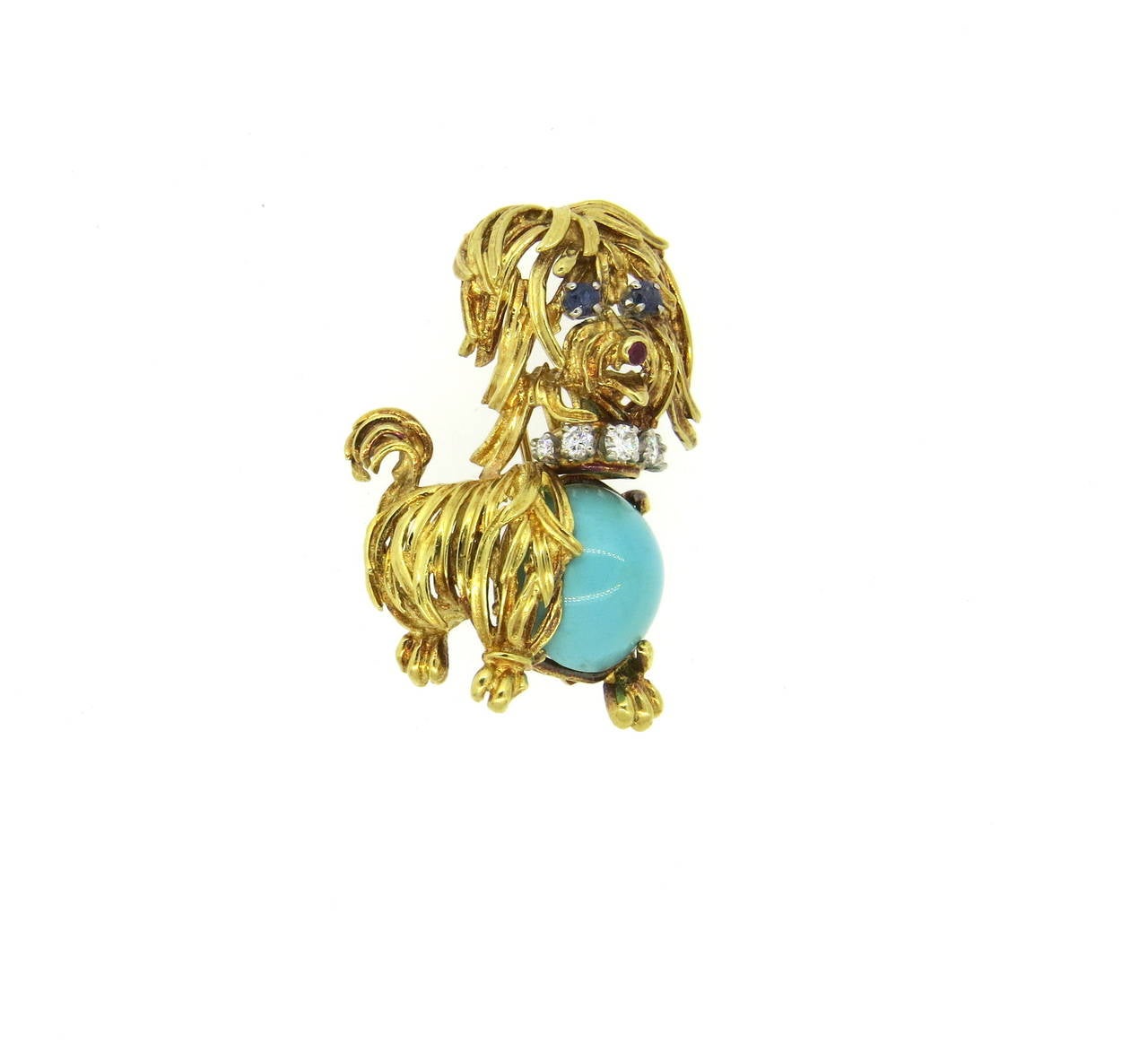 Vintage 1960s 18k gold brooch, depicting a dog, set with turquoise, sapphire eyes, ruby nose and diamond collar. Brooch measures 40mm x 21mm. Weight of the piece - 14.3 grams