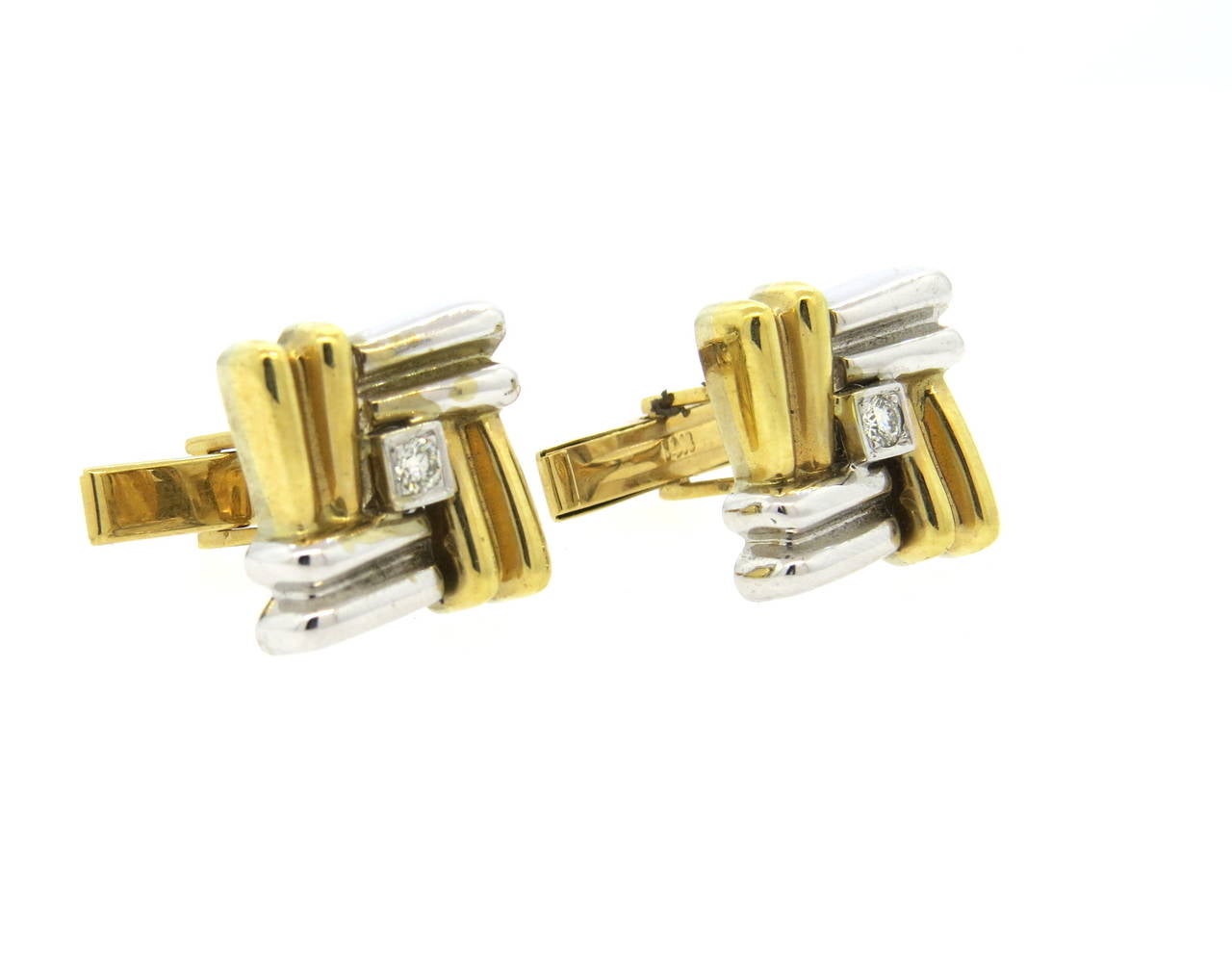 Classic 14k two tone gold cufflinks, each set with 0.05ct diamond in the center. Cufflinks measure 16mm x 16mm. Weight - 19.4 grams