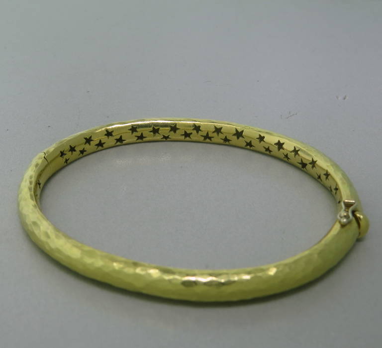 H.Stern 18k hand hammered yellow gold bangle bracelet. Will comfortably fit up to 7