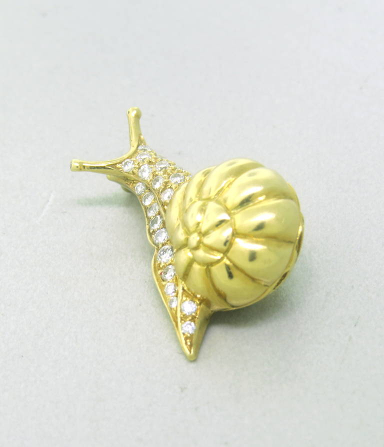 Adorable snail brooch by Tiffany & Co, set in 18k yellow gold with diamonds. Measures 30mm x 16mm. Marked Tiffany & Co and 750.