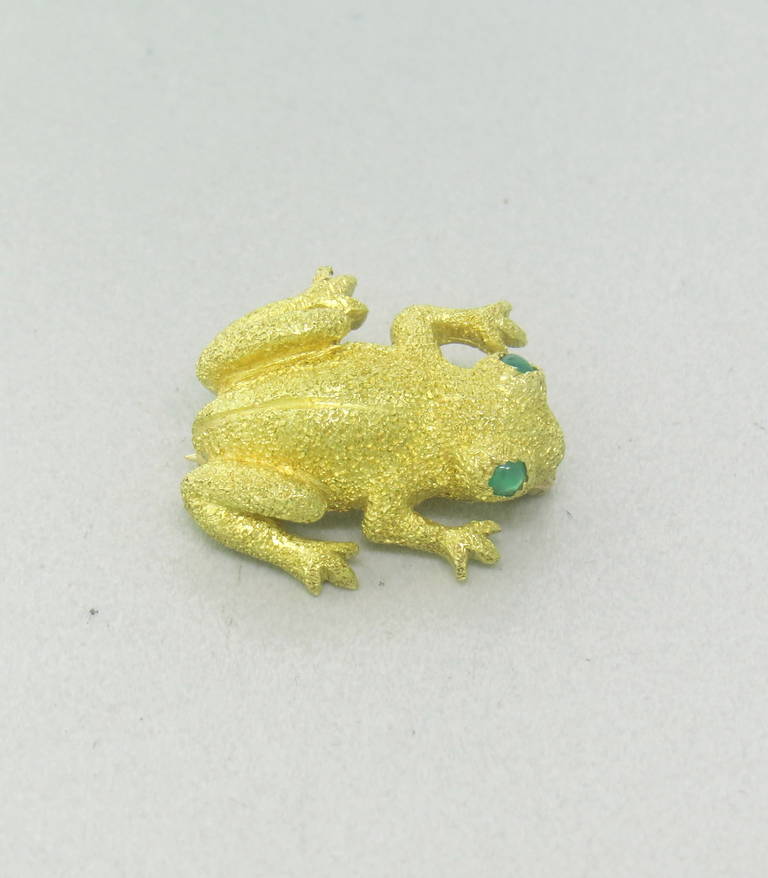 18k Yellow Gold Frog Brooch with Emerald Eyes by Tiffany & Co.  The frog measures 19mm x 17.5mm and weighs 5.9 grams.