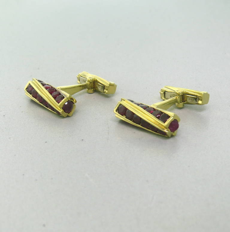 18k Yellow Gold Cufflinks set with approximately 2.50cts in rubies.  Cufflinks measure 21.3mm x 6.5mm and weigh 13.9 grams.