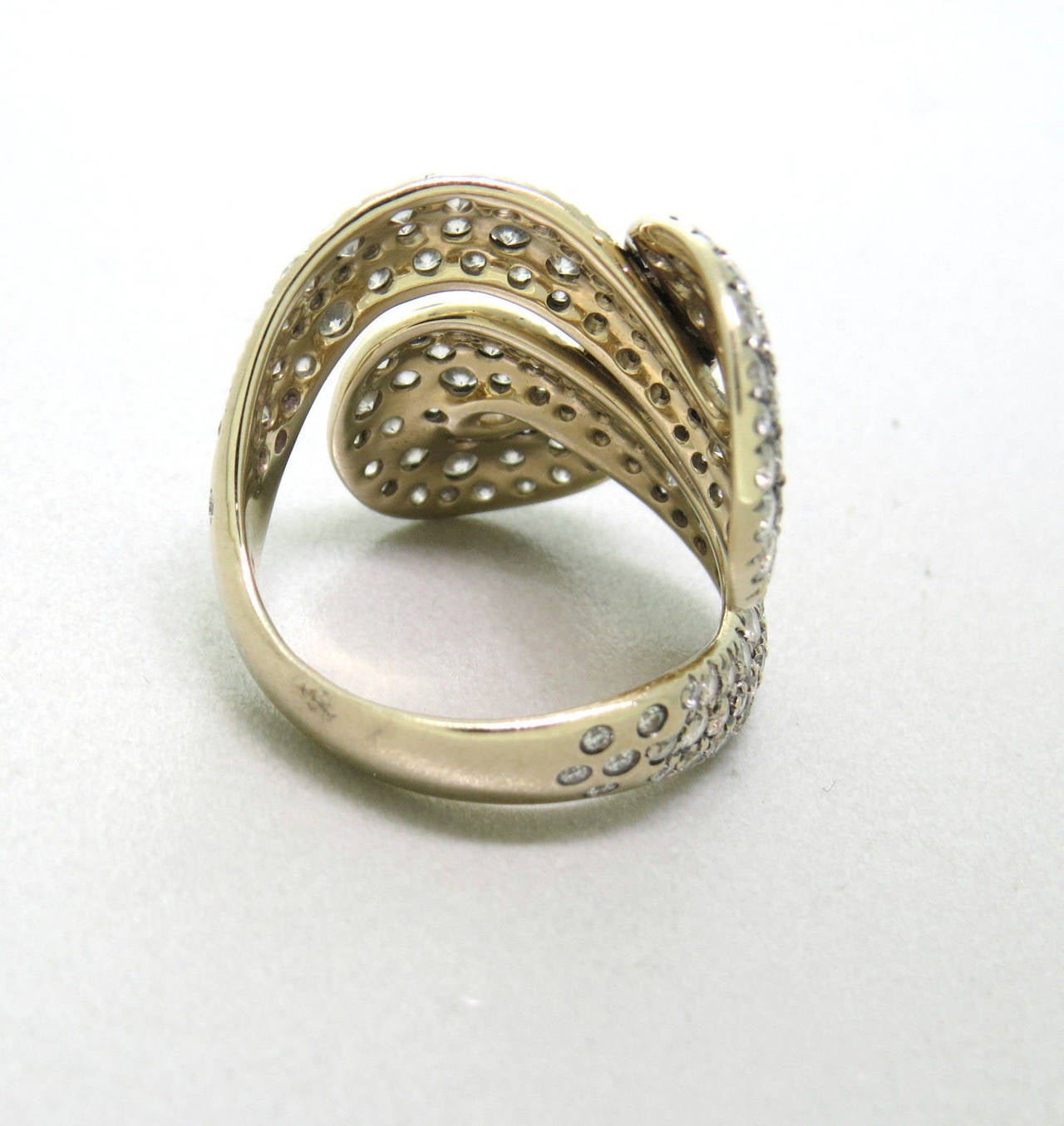 Impressive 18k gold and fancy diamond ring, crafted by H Stern for Celtic Dunes collection, featuring 2.97ctw in diamonds. Ring is a size 7, Top Of Ring 25mm x 27mm. Marked with Star hallmark and 18k. Weight of the piece - 8.7 grams
Retails for