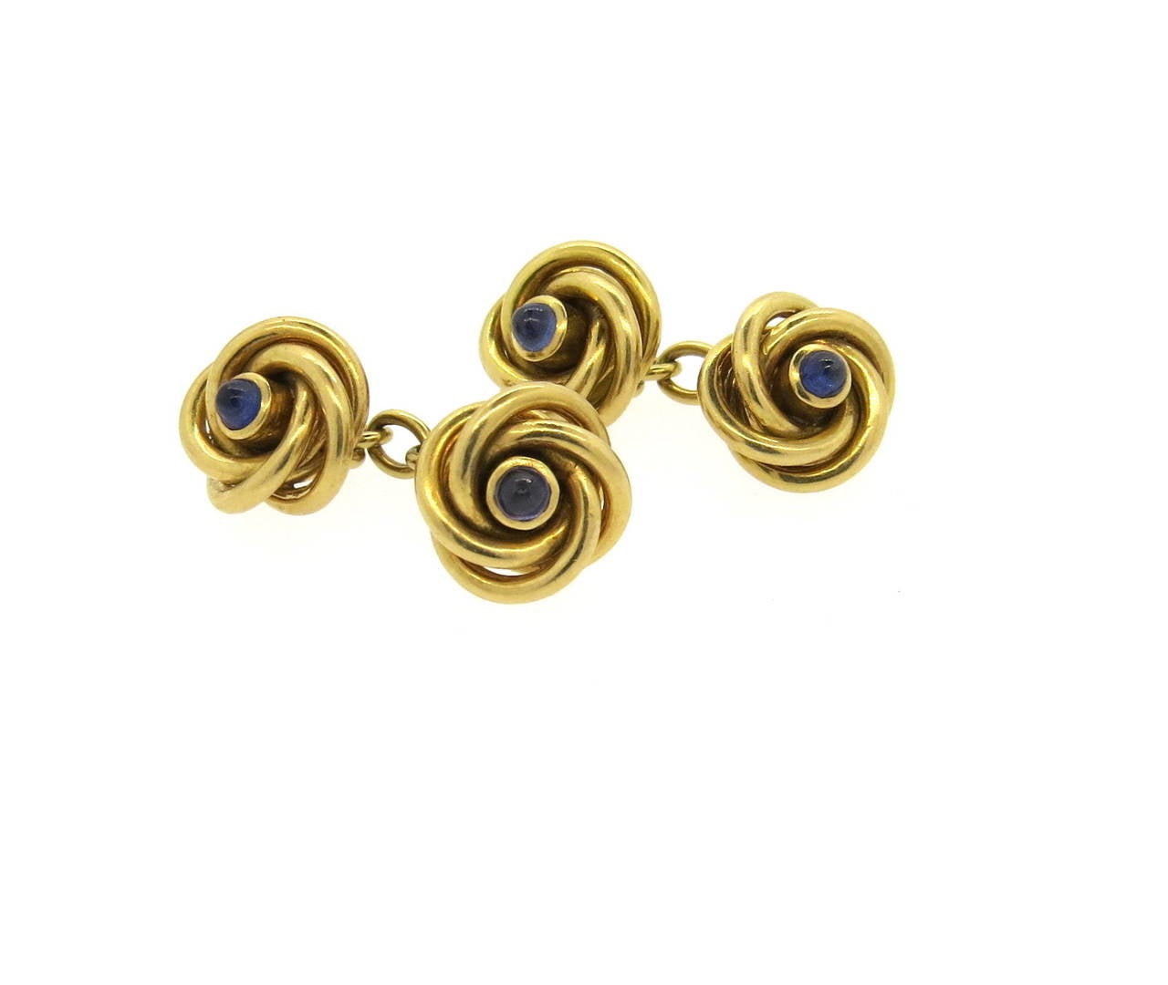 Retro 18k gold knot cufflinks, decorated with sapphires in the center. Cufflink top measures 13mm in diameter. Weight - 18.1 grams