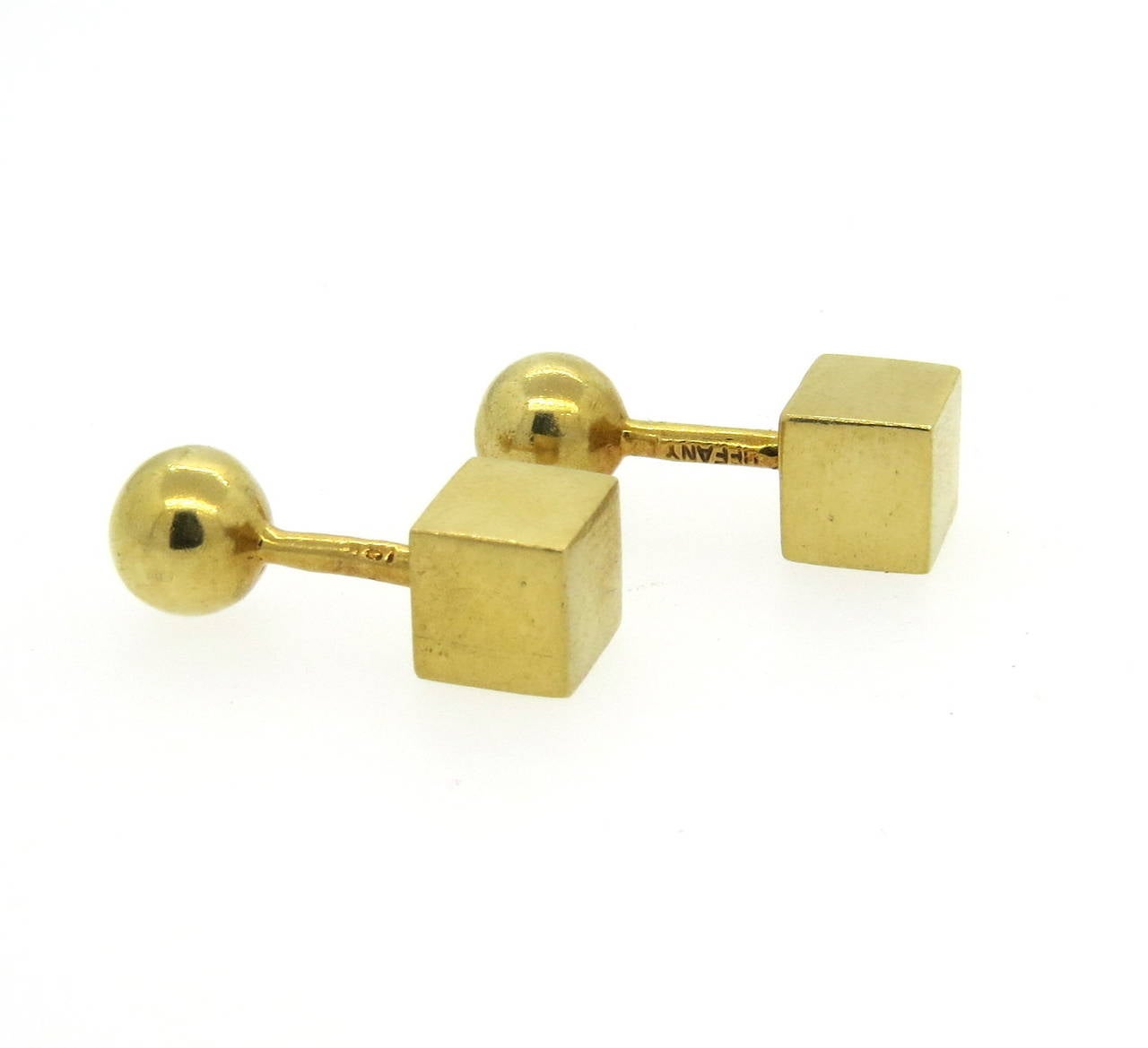 Tiffany & Co 18k gold geometric design cufflinks, deaturing one ball end and one cube. Ball measures 9.2mm in diameter, cube - 9mm x 9mm. Marked Tiffany, 18k. Weight - 20.6 grams