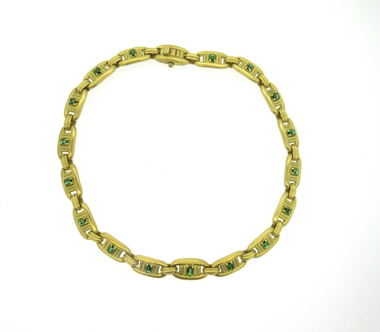 1980s 18k gold necklace, crafted by Barry Kieselstein Cord, set with emerald cut 5mm x 3mm green tourmalines. Necklace is 16 3/8