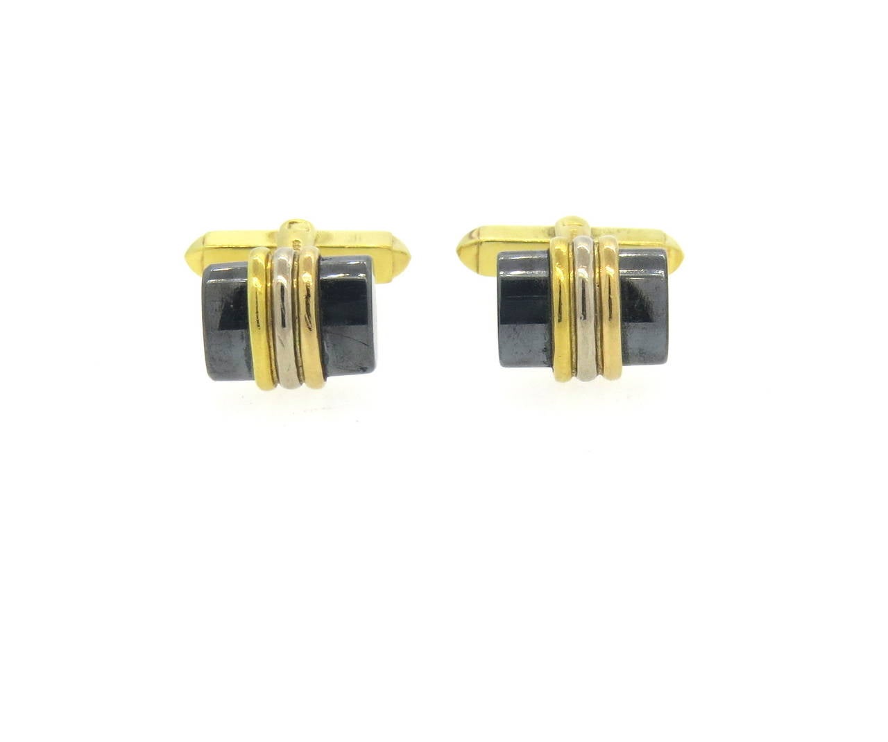 18k yellow, white and rose gold cufflinks, crafted by Deakin & Francis, set with hematite. Top measures 14mm x 11mm. Marked D & F and with English gold marks. Weight - 14.8 grams