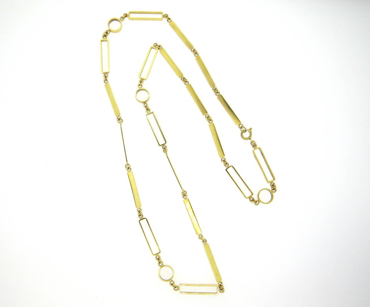 1970s 18k yellow gold necklace, designed with rectangular and circle links. Necklace is 30