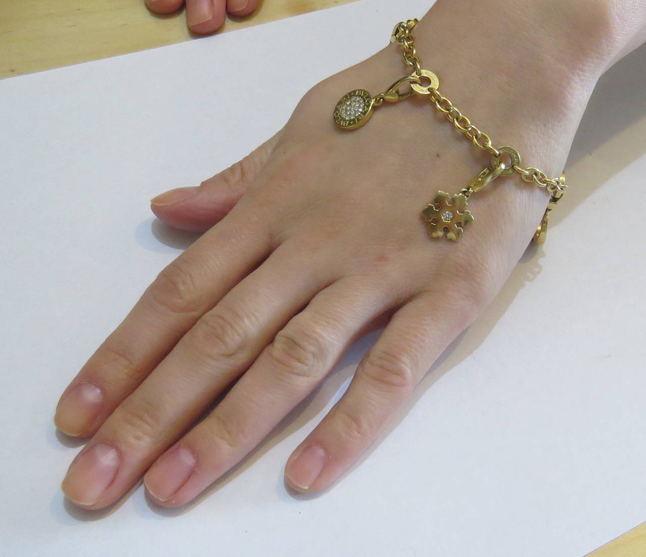 Bulgari Onyx Lapis Diamond Gold Charm Bracelet In Excellent Condition In Lambertville, NJ