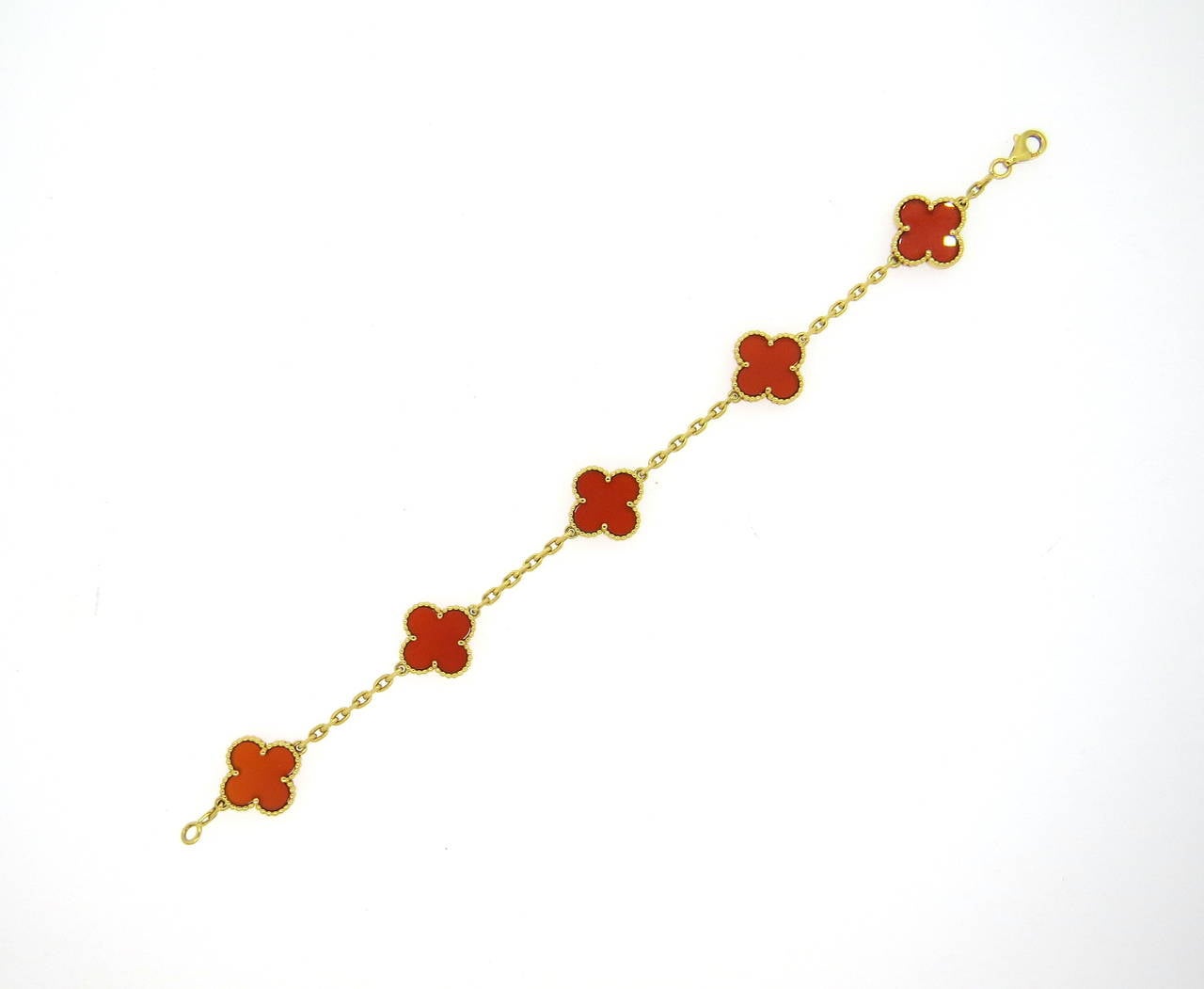 Beautiful 18k yellow gold clover necklace and bracelet set, crafted by Van Cleef  & Arpels for iconic Vintage Alhambra collection, set with carnelian stones. Necklace is 17
