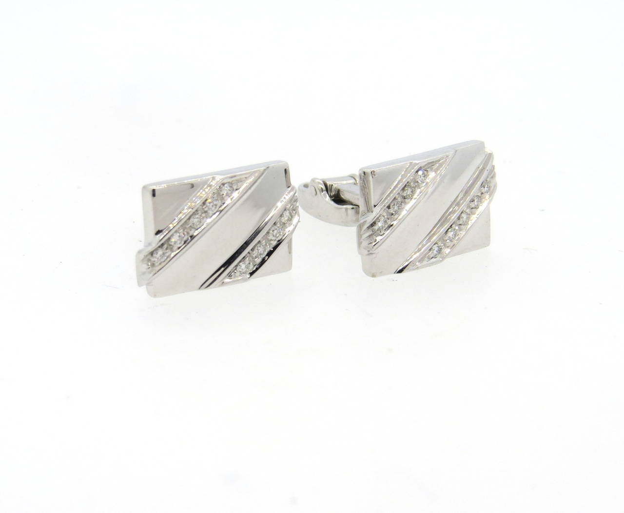 A pair of classic 18k white gold cufflinks, decorated with approximately 0.18ctw in GH/VS diamonds. Top of the cufflink measures 17mm x 11mm. Weight - 15.4 grams