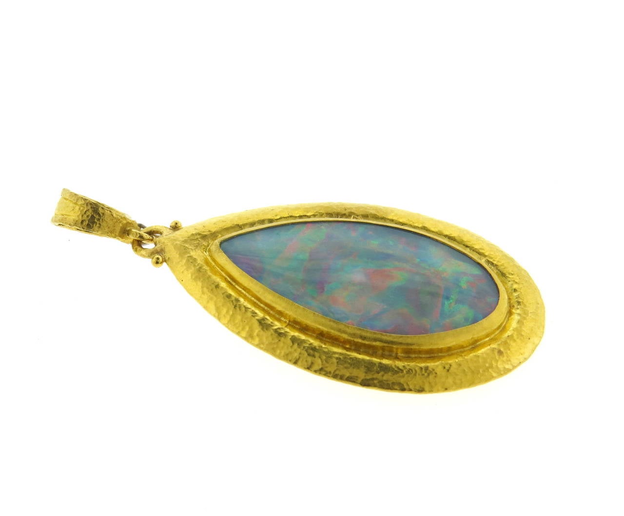 Large 24k gold enhancer pendant, crafted by Gurhan, set with  46mm x 23mm opal gemstones in the center. Pendant measures 82mm with bale x 39mm (pictured chain is not included) Marked with Gurhan hallmark and PD043 0.990. Weight of the piece - 34.6