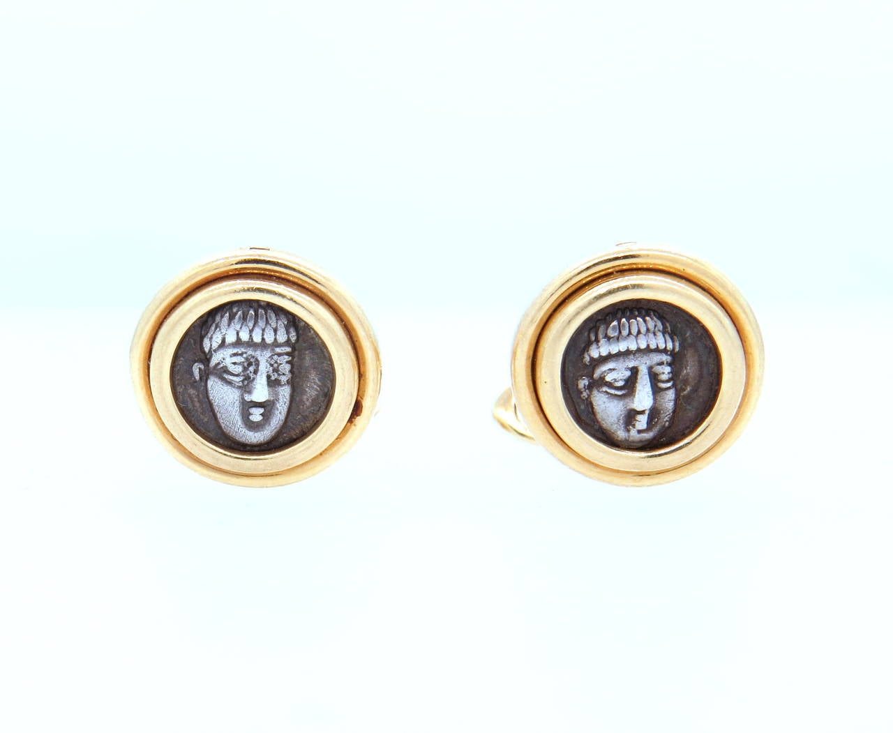 18k yellow gold cufflinks, crafted by Bulgari with ancient coin in the center. Top measures 15mm in diameter. Marked Bvlgari, 750, Campania - Phistelia, IV. Weight - 20.3 grams