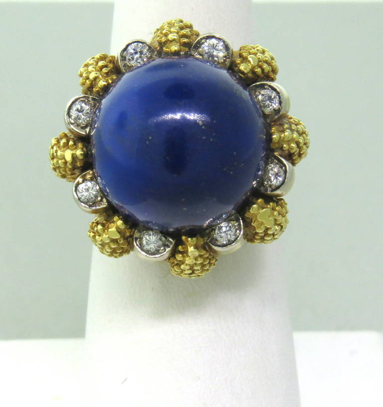 1970s Tiffany & Co 18k yellow gold ring,featuring 16mm lapis lazuli,surrounded with diamonds. Ring size 7, ring top is 25mm in diameter, ring sits approx. 21mm from the finger. Marked 18k and Tiffany & Co. weight - 26.2gr