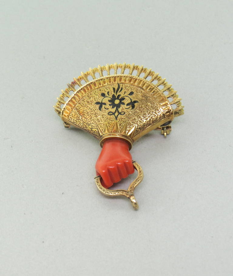 1870s antique gold brooch with carved hand shaped coral stone and enamel. Brooch measures 42mm x 35mm. weight 5.7gr
