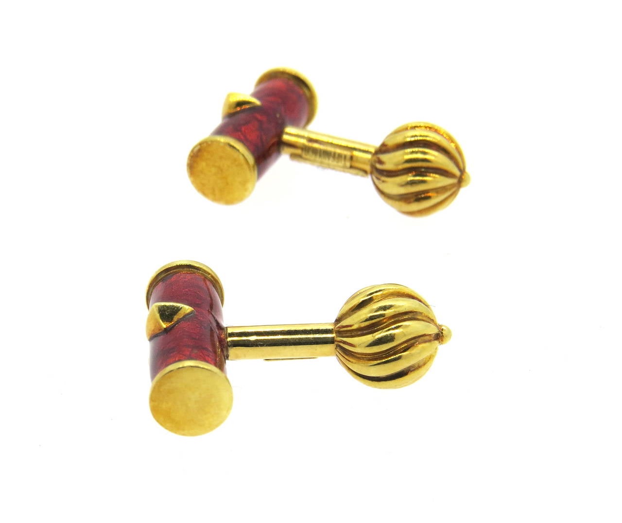 A pair of 18k yellow gold cufflinks, designed by Jean Schlumberger for Tiffany  & Co, decorated with red enamel on the top. Cufflink to measures 18mm x 7mm, back - 8.8mm in diameter. Marked Tiffany & Co, 750, Schlumberger. Weight - 14.2 grams.
Come