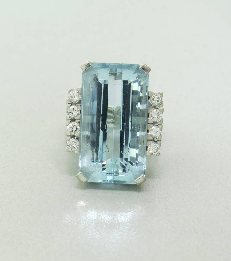 An 18k white gold ring set with a 16.50ct aquamarine and approx. 0.32ctw in diamonds.  The ring is a size 5.5 and weighs 14.3 grams.