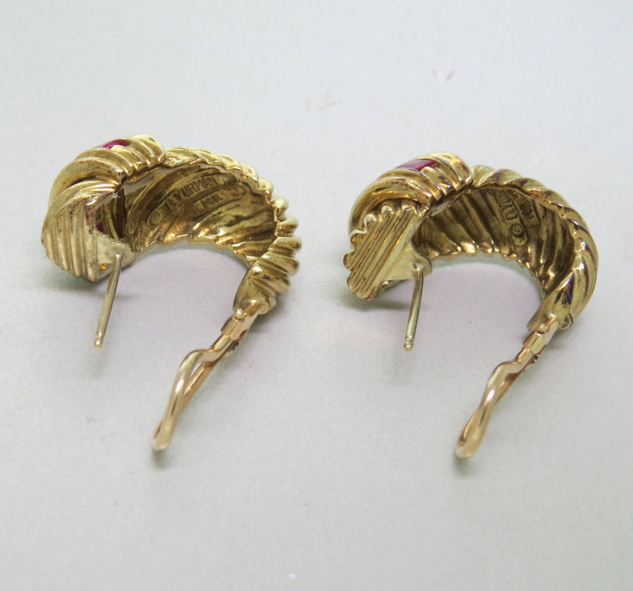 14k yellow gold shrimp earrings with rubies by David Yurman. Earrings measure 25mm x 15mm. The weight of the earrings is 22.6 grams. Signed: D.Yurman, 14K