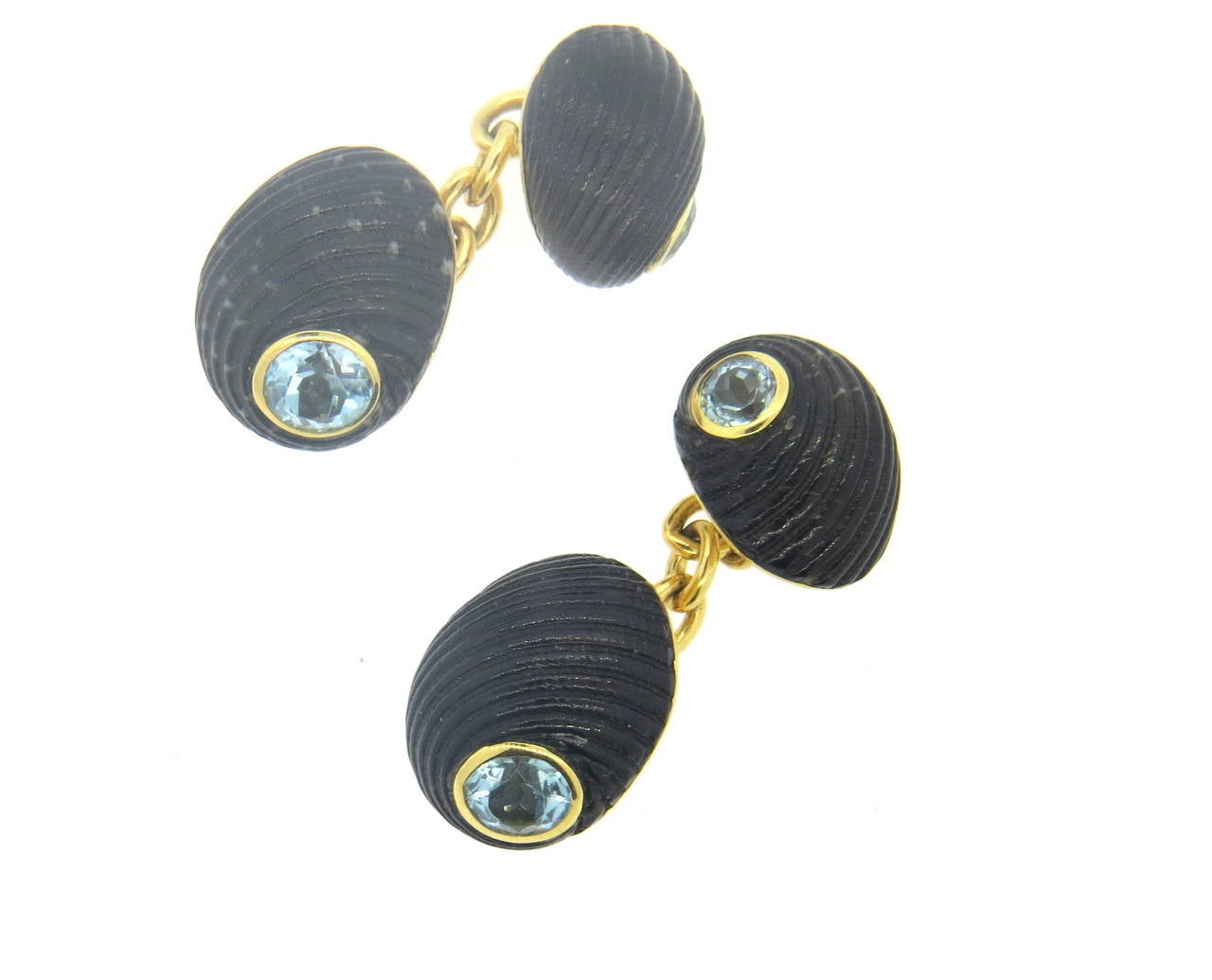 Pair of new 18k yellow gold cufflinks, crafted by Trianon, decorated with shell top and aquamarine gemstones in the center. Top measures 15mm x 13mm, back - 12mm x 10mm. Marked with Trianon mark, 750, Trianon. Weight - 8.2 grams
Retail $4000