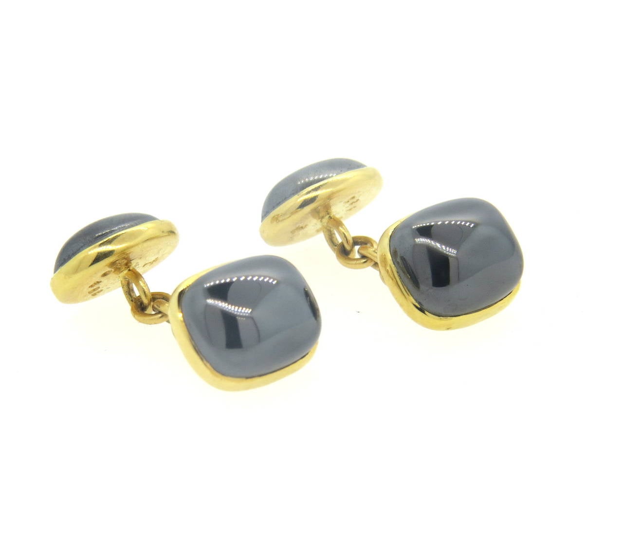 Pair of 18k yellow gold cufflinks, crafted by Trianon, set with hematite stones. Top measures 14mm x 11mm, oval back - 13mm x 10mm. Marked Trianon, 750,29482. Weight - 12.5 grams
Retail $2700