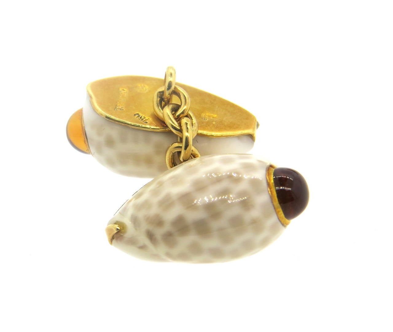 18k yellow gold cufflinks, crafted by Trianon, set with shell top and citrine cabochons. Each top measures 20mm x 11mm. Marked 750 and Trianon. Weight - 11.4 grams
Retail $3800