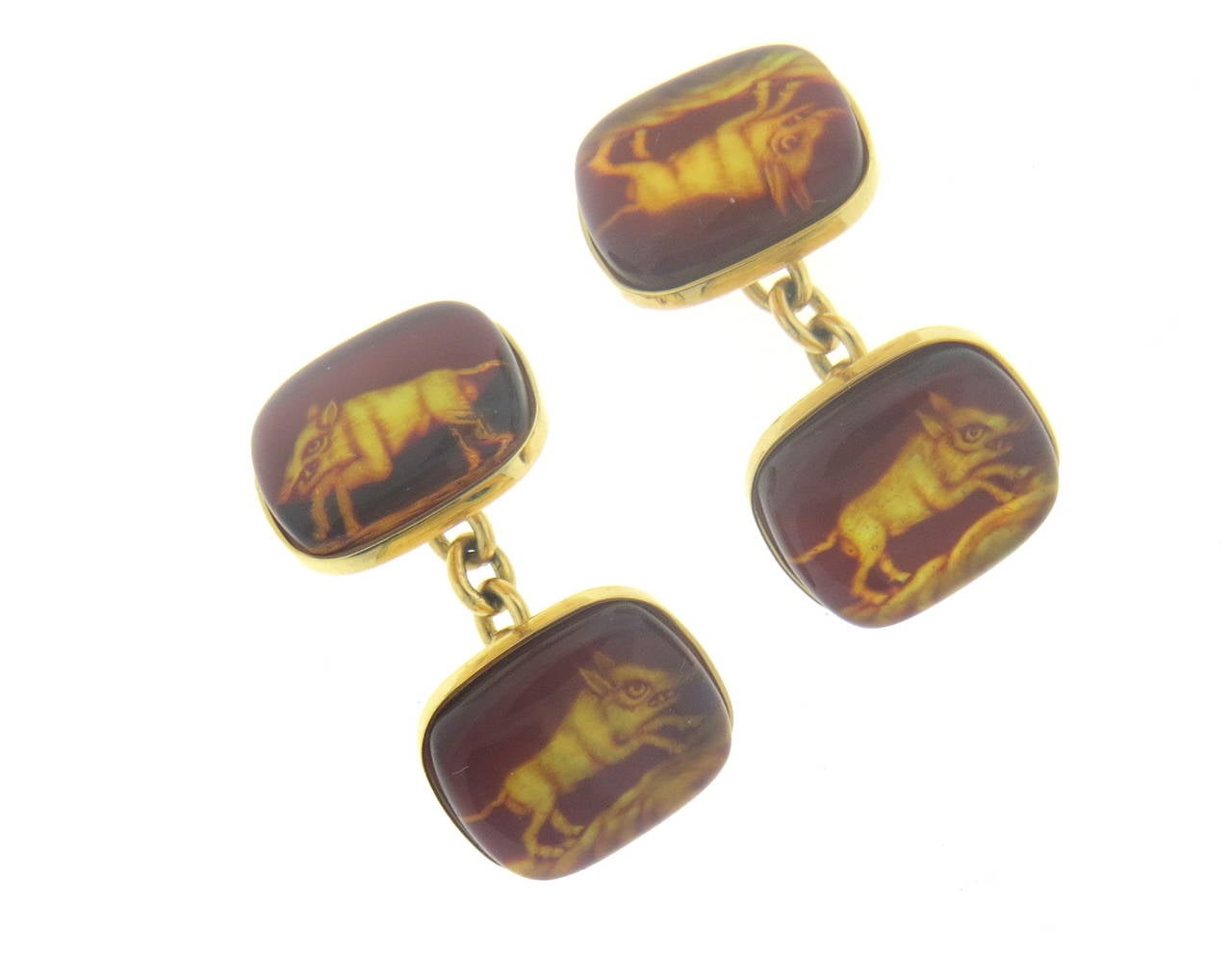 Pair of new 18k yellow gold cufflinks, crafted by Trianon, featuring amber top, depicting wild hog. Each top measures 15mm x 13mm. Marked Trianon, 750. Weight - 9.7 grams
Retail $3000