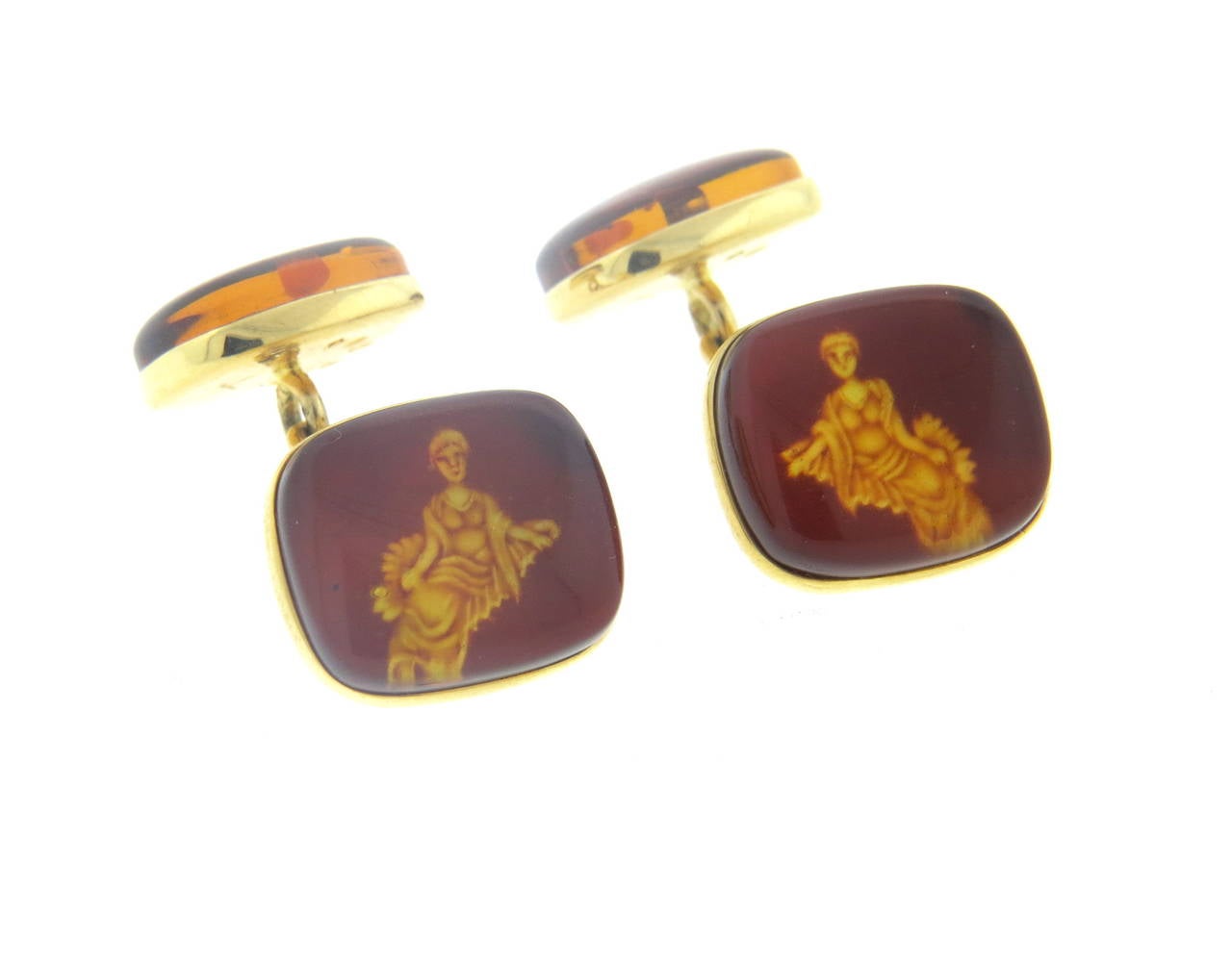 Pair of new 18k yellow gold cufflinks, crafted by Trianon, featuring amber top depicting Virgo zodiac sign. Top measures 15mm x 13mm, back - 13mm x 11mm. Marked Trianon, 750. Weight - 8.1 grams
Retail $3000