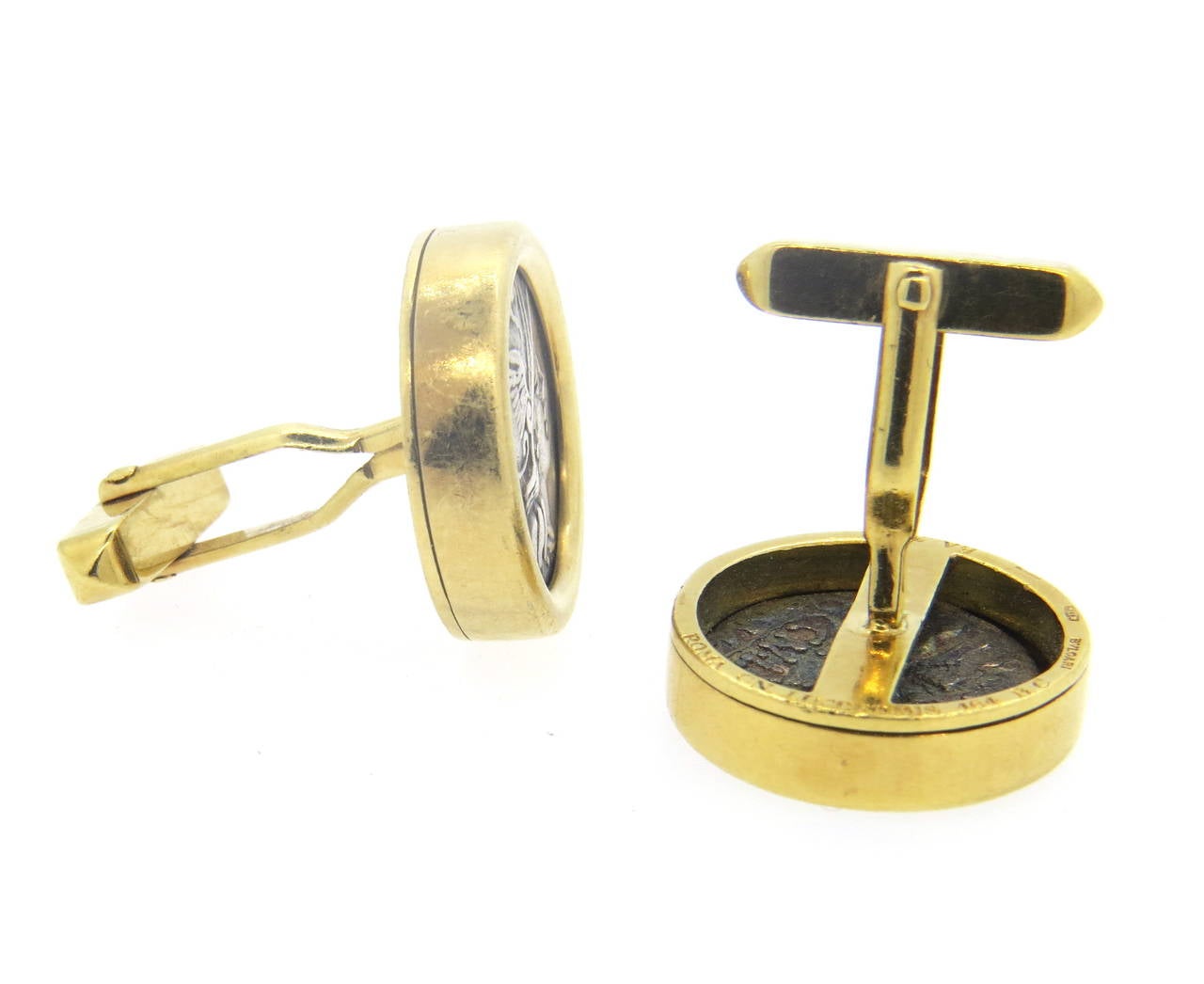 Pair of 18k yellow gold cufflinks, crafted by Bulgari, set with 16mm ancient coins. Top measures 21mm in diameter. Marked Bvlgari, 750, Roma-Pinarius,164 B C, 200 B C.  Weight - 27.2 grams