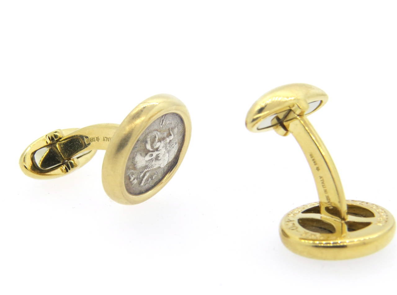Pair of 18k yellow gold cufflinks, crafted by Bulgari, set with ancient coins in the center. Top measures 17mm in diameter. Marked Bvlgari,750, made in Italy, Macedonia - Acanthus, 170-390 B.C. Weight - 22.7 grams