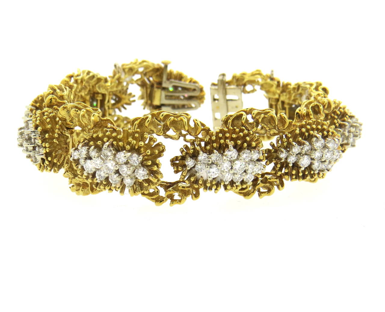 Circa 1960s 18k yellow gold bracelet, decorated with approximately 5.00 - 5.50ctw in G/VS diamonds. Bracelet is 6 1/2