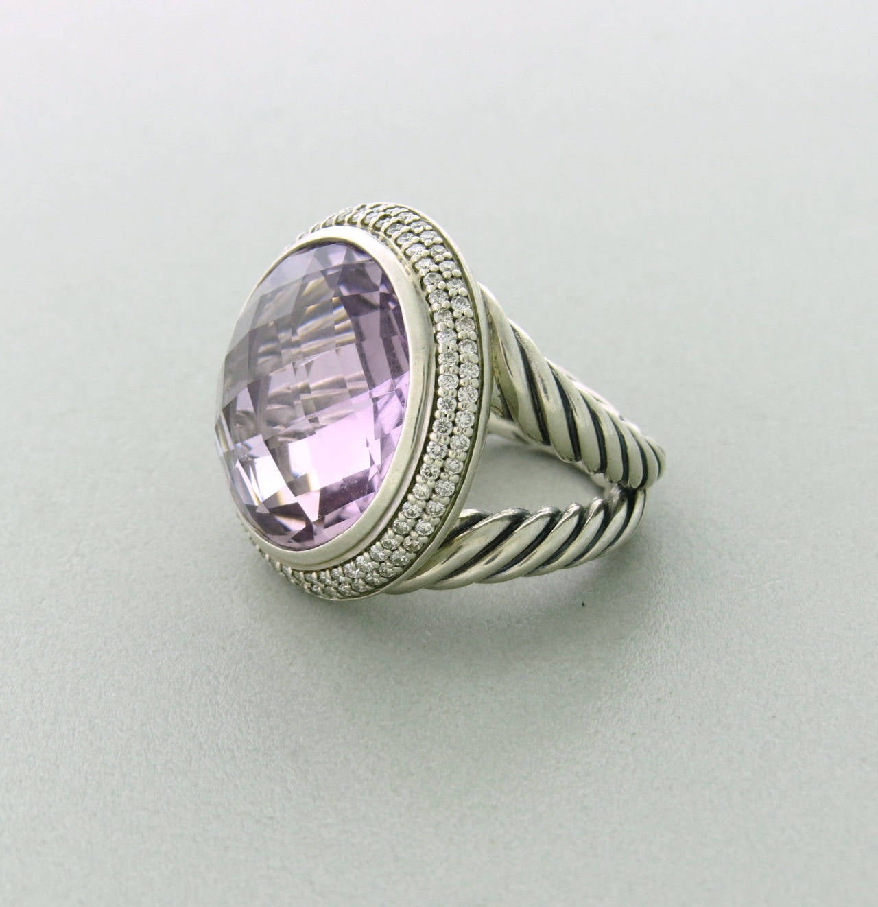 David Yurman Cerise ring featuring 17mm round amethyst surrounded by 0.70ctw in diamonds set in sterling silver.  The ring is a size 6.