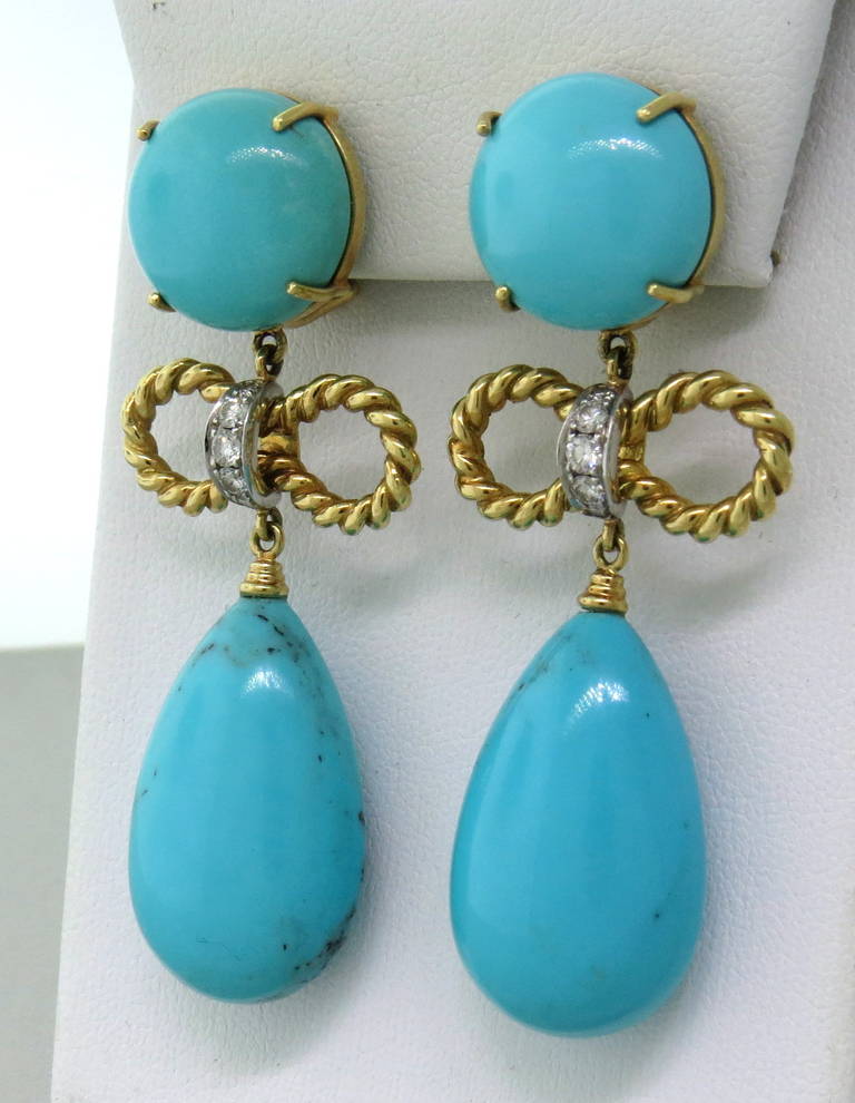 18k gold and platinum earrings by D. Bouzan,featuring turquoise gemstones and approx. 0.40ctw in G/VS diamonds. Earrings are 58mm long and 25mm at widest points. Marked D.Bouzan,pt950, and 750. weight - 31.3gr