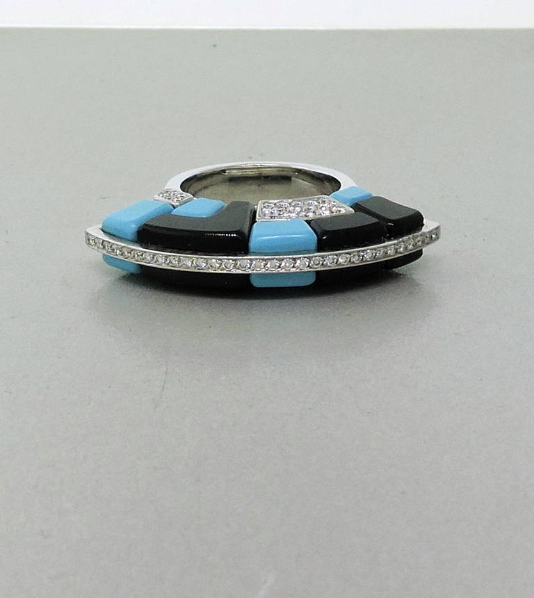 Georland France 18K white gold ring featuring onyx, turquoise and approx. 0.70ctw of diamonds set in a fan design. Ring size 6 1/2, ring top measures 37mm x 6mm and sits approx. 12.5mmn from finger. Marked Georland, 750. Weight - 19.2gr