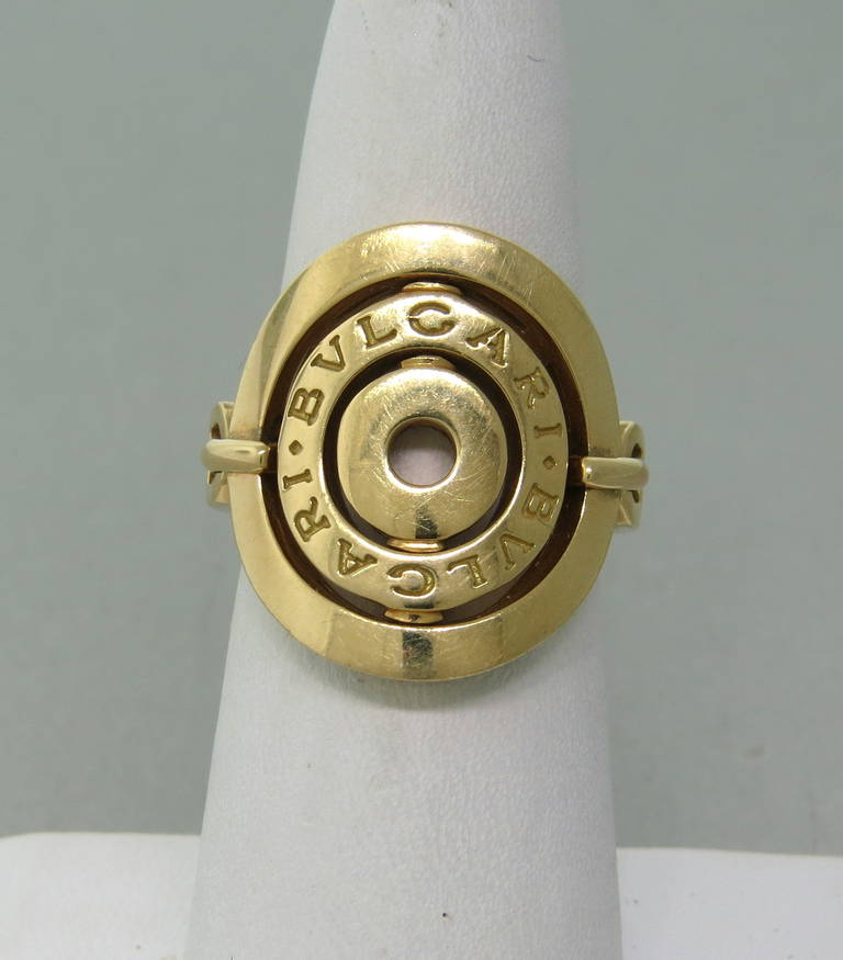 Bulgari 18K yellow gold shield ring from the Astrale Collection. Ring size 6 1/2, ring top measures 21.9mm x 18.5mm. Marked Bvlgari, 750, Made in Italy. Weight - 12.2g