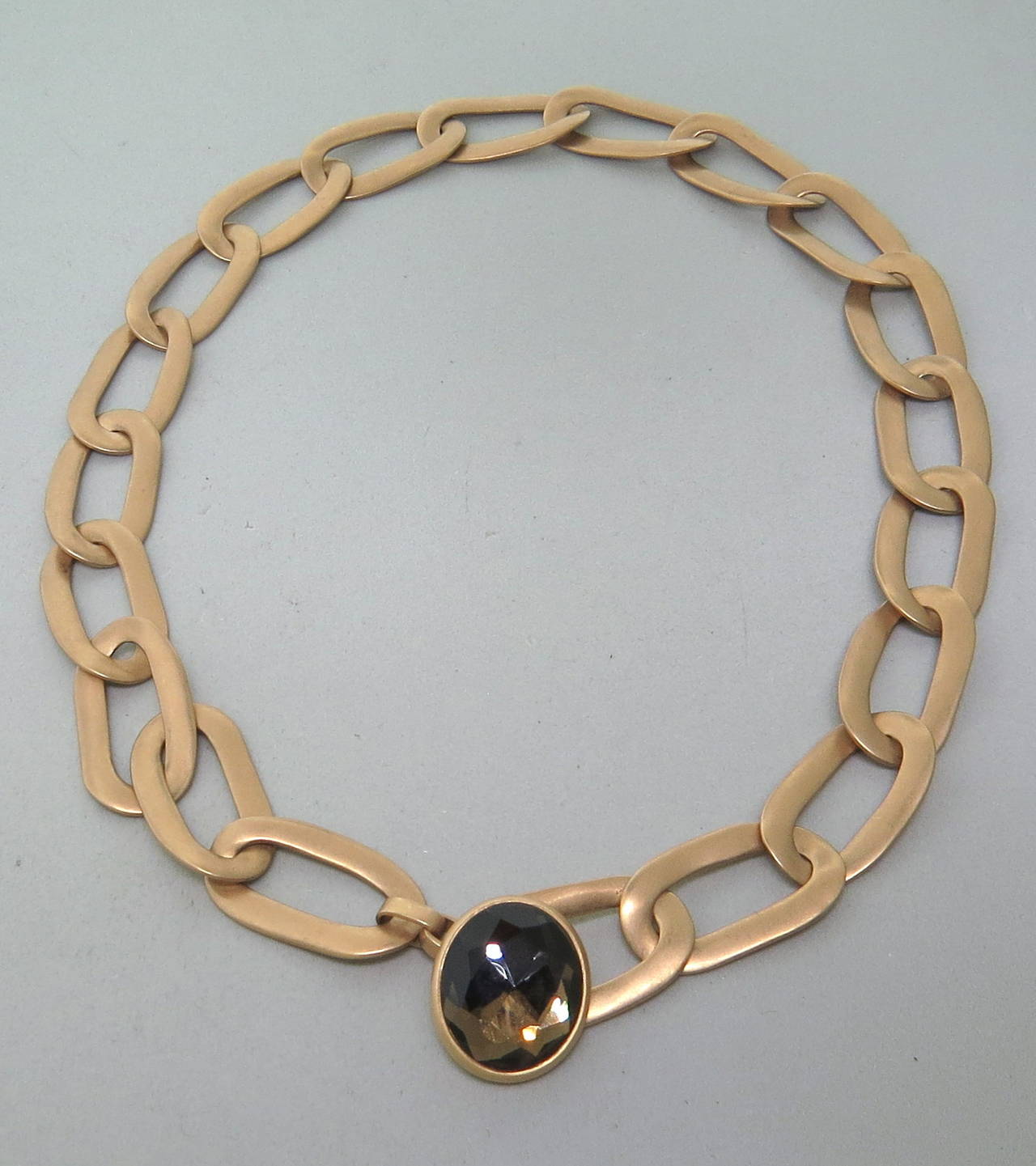 Pomellato 18k gold oval link necklace with smokey topaz from Narciso collection. Necklace is 17