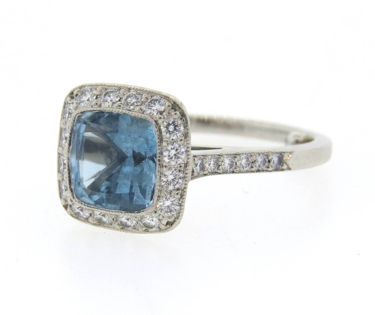 Tiffany & Co platinum ring from Legacy collection with diamonds and aquamarine. Ring size 5 (sizing balls can be removed to increase size) , ring top is 11mm x 11mm.  Marked Tiffany & Co, pt950, pat.D467.833 et al, 24294498. Weight - 5.5gr.