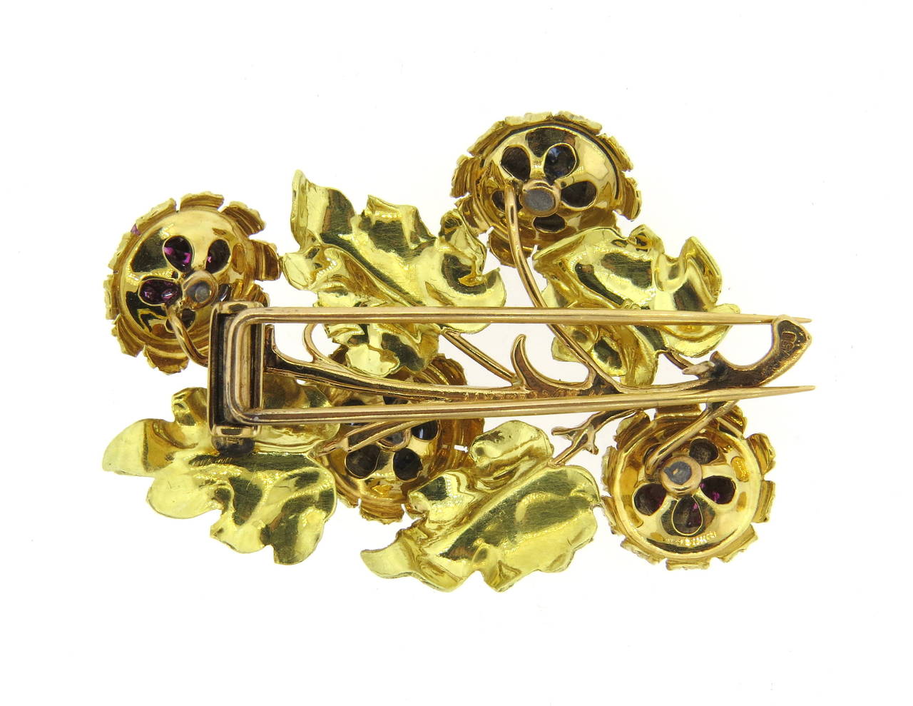 Mario Buccellati 18k gold brooch with sapphire and ruby flower, gold leaves. Brooch measures 51mm x 36mm. Marked M. Buccellati,750. weight - 20gr