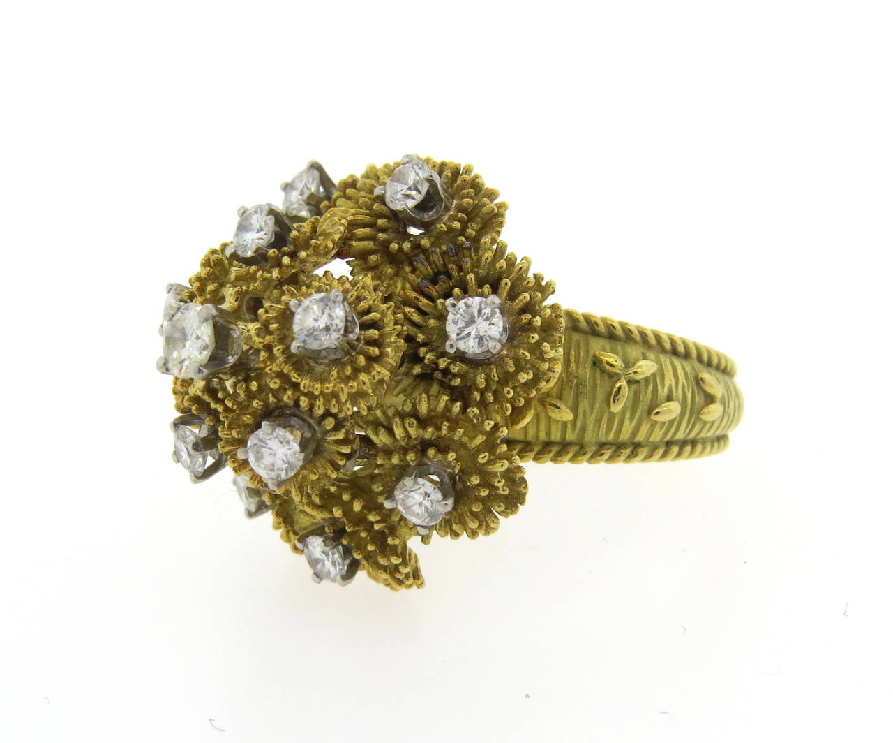 Circa 1970s large 18k yellow gold ring set with approximately 1.50ctw diamonds VS-Clarity , G/H - color. The top of the ring is 23mm in diameter, sits 17mm high from the finger. Finger size 7 3/4, weight -15.3g. Marked: TLI 18k.