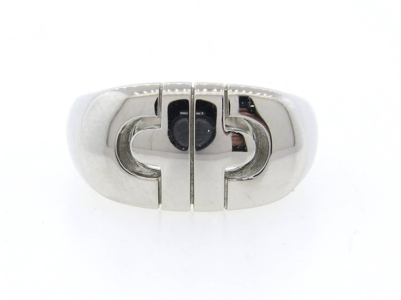 An 18k white gold ring from the Parentesi collection by Bulgari.  The ring is a size 8 and measures 11mm wide at the widest point.  The weight of the ring is 8.64 grams.