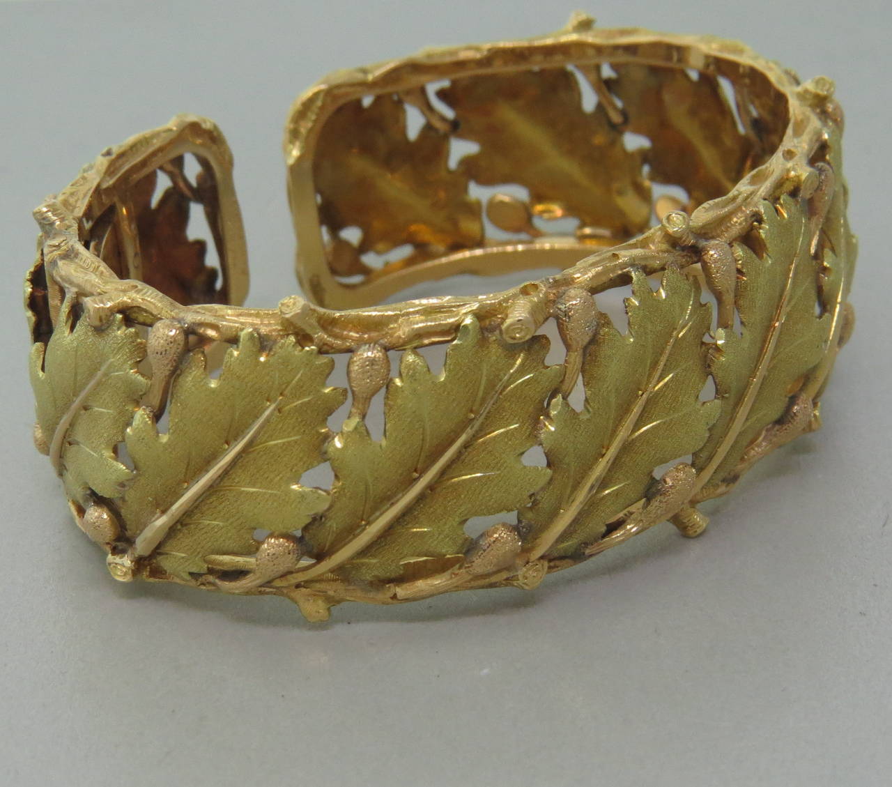 Buccellati 18k gold cuff bracelet with hinged closure and beautiful leaf motif design. Will comfortably fit up to 6 1/2