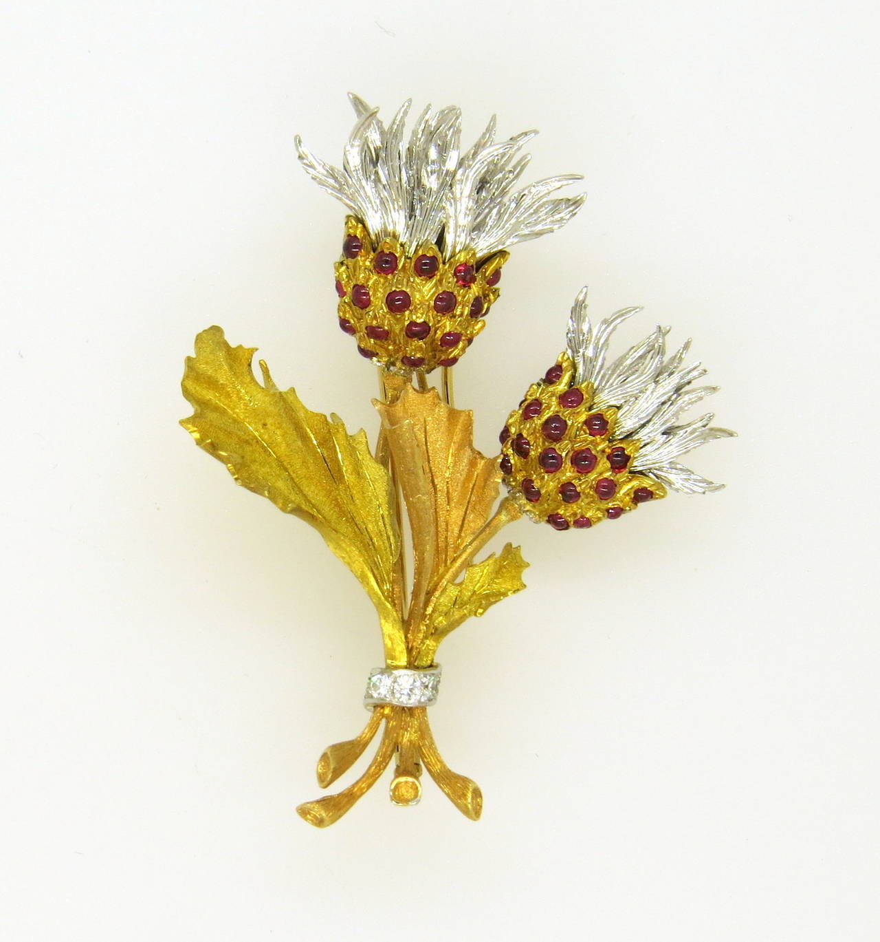 Buccellati 18k white, yellow and rose gold thistle brooch, set with diamonds and ruby cabochons. Brooch is 65mm x 52mm. Marked Buccellati Italy. weight - 30.4 gr