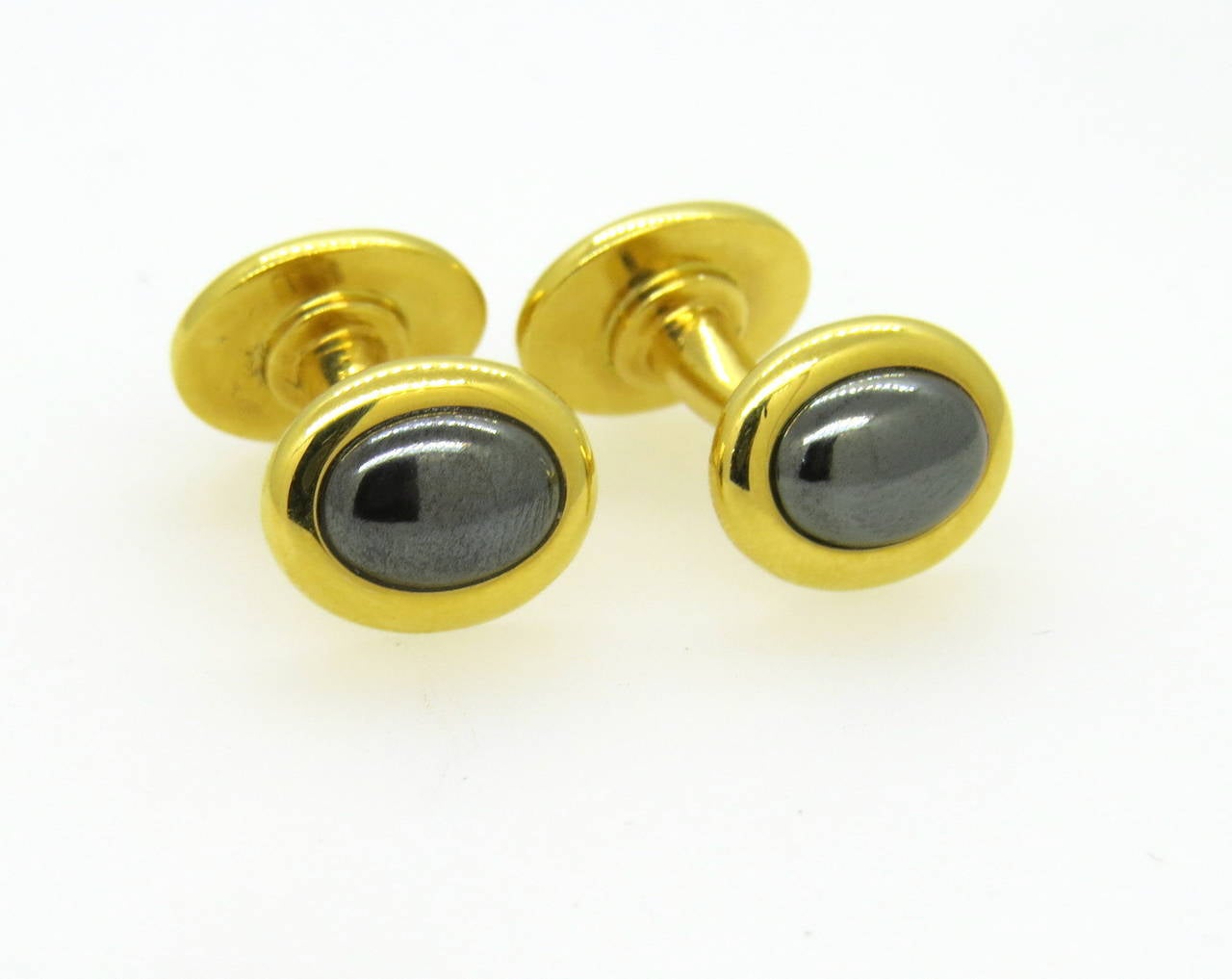 18k gold cufflinks by Trianon with hematite stones. Top measures 13mm x 10m. weight - 11.9 gr