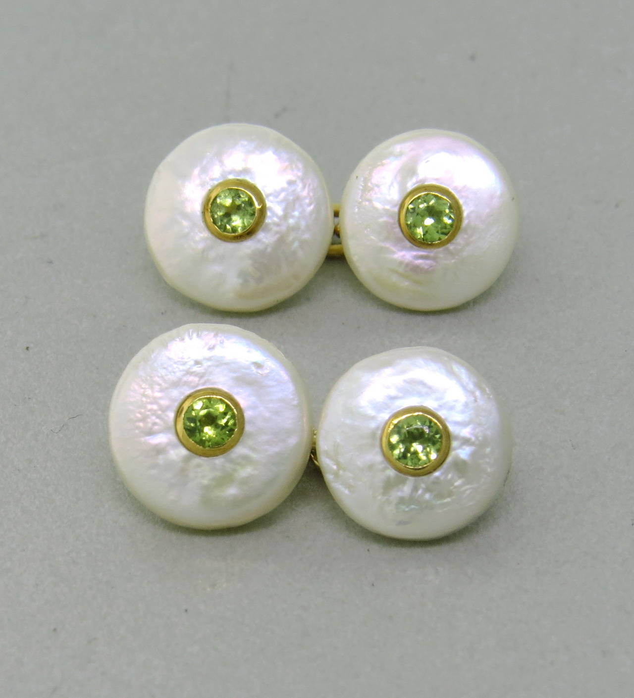 Trianon 18k gold cufflinks with pearl top and peridot in the center. Top measures 12mm in diameter. Weight - 5.8 gr